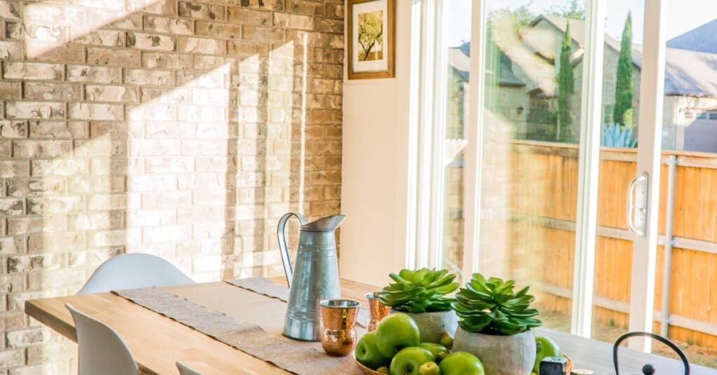 pexels-photo-1080696-1080696 Sunlit dining room with contemporary decor and a rustic brick wall, featuring stylish lighting and a wooden table.